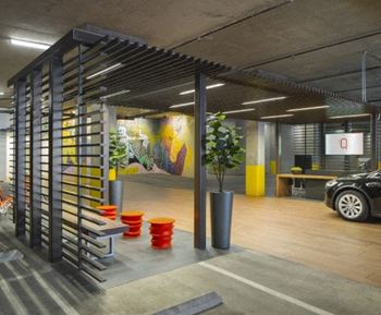 the interior of a parking garage with a car