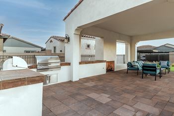 BBQ with seating area Stainless Steel Appliances and vinyl wood plank flooring at Pillar at Fountain Hills apartments, Arizona
