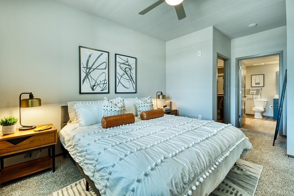 Bedroom with bed and bathroom at Cuvee, Glendale, AZ