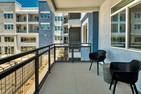 Balcony with 2 chairs overlooking Cuvee buildings at Cuvee, Glendale Arizona