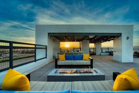 Rooftop patio with tables and chairs and firepit at Cuvee, Glendale, AZ 85305