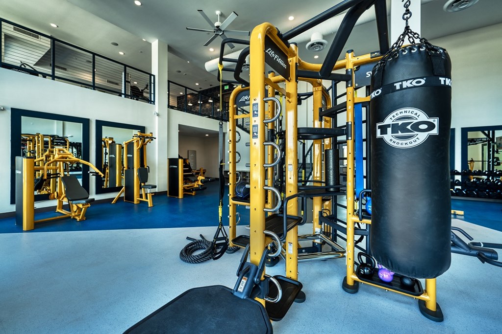 Two-story fitness center with free weights and punching bag at Cuvee, Glendale, 85305