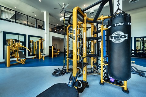 Two-story fitness center with free weights and punching bag at Cuvee, Glendale, 85305