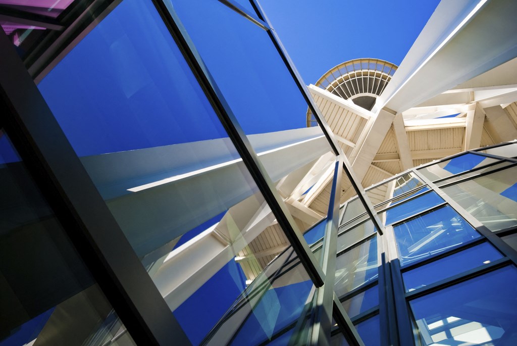 a view of a building with glass windows and a tower