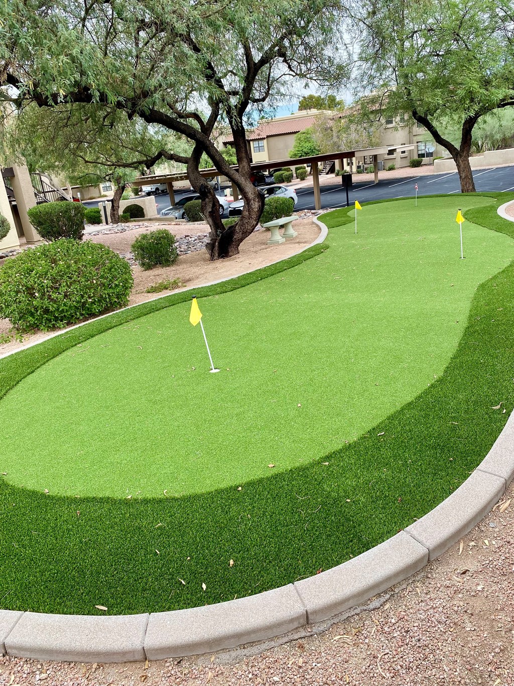 A yellow flag on a golf hole.