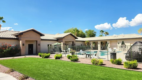 A house with a pool and a patio area.