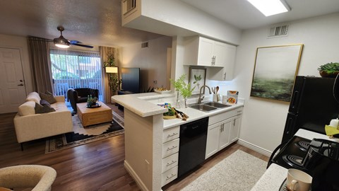 A kitchen with a black stove top oven.