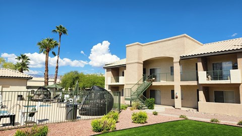 A building with a palm tree in front of it.