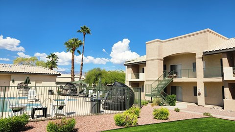 A sunny day at the poolside of a residential building.