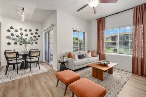 A living room with a dining table and chairs.