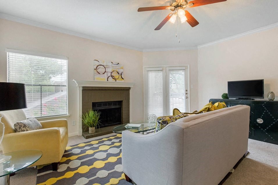 a living room with a couch and a fire place