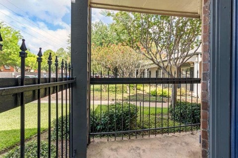 a wrought iron fence in front of a house