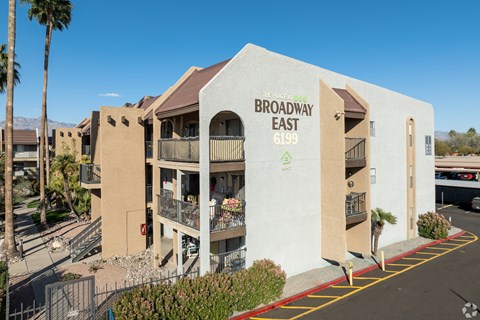 The image shows a building with the sign "Broadway East 6199" on it.