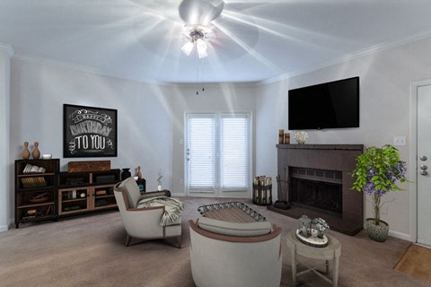 a living room with a fireplace and a ceiling fan