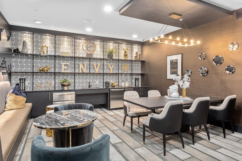 A modern dining room with a large table and chairs. at The Hendry, Henderson, NV