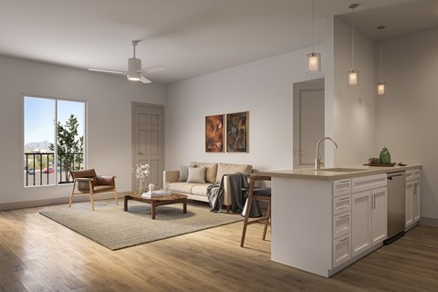 A modern living room with a kitchen area in the background.