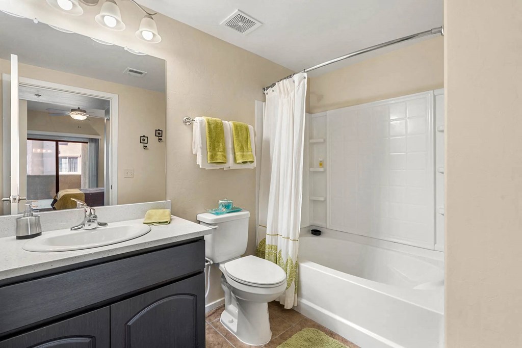 A bathroom with a white toilet and sink.