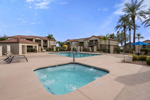 A large swimming pool in the middle of a residential area.