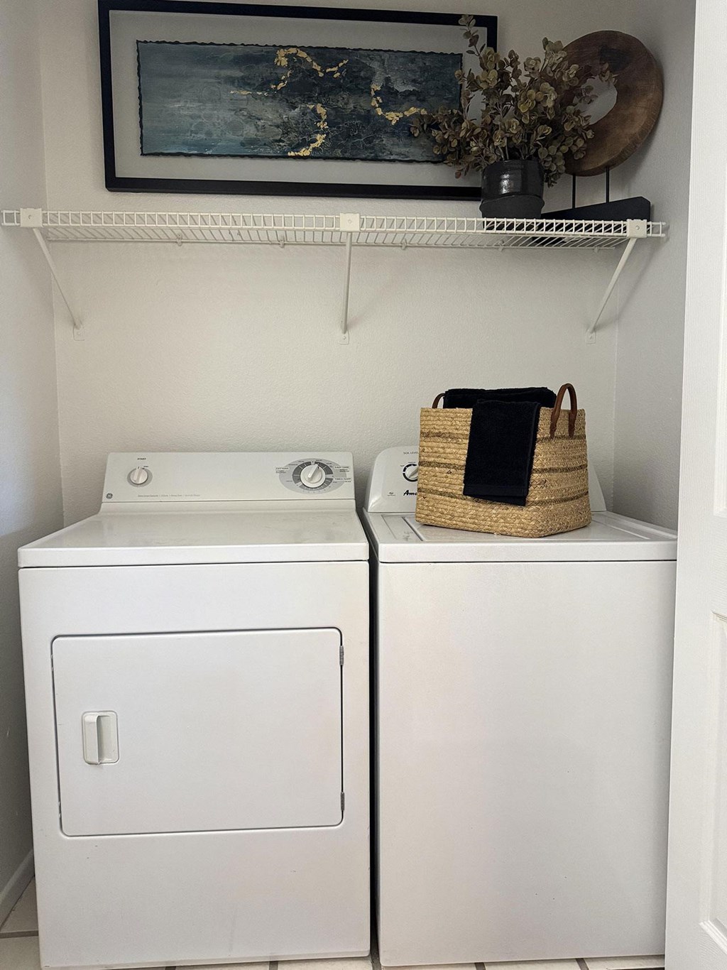 A washer and dryer are sitting next to each other.