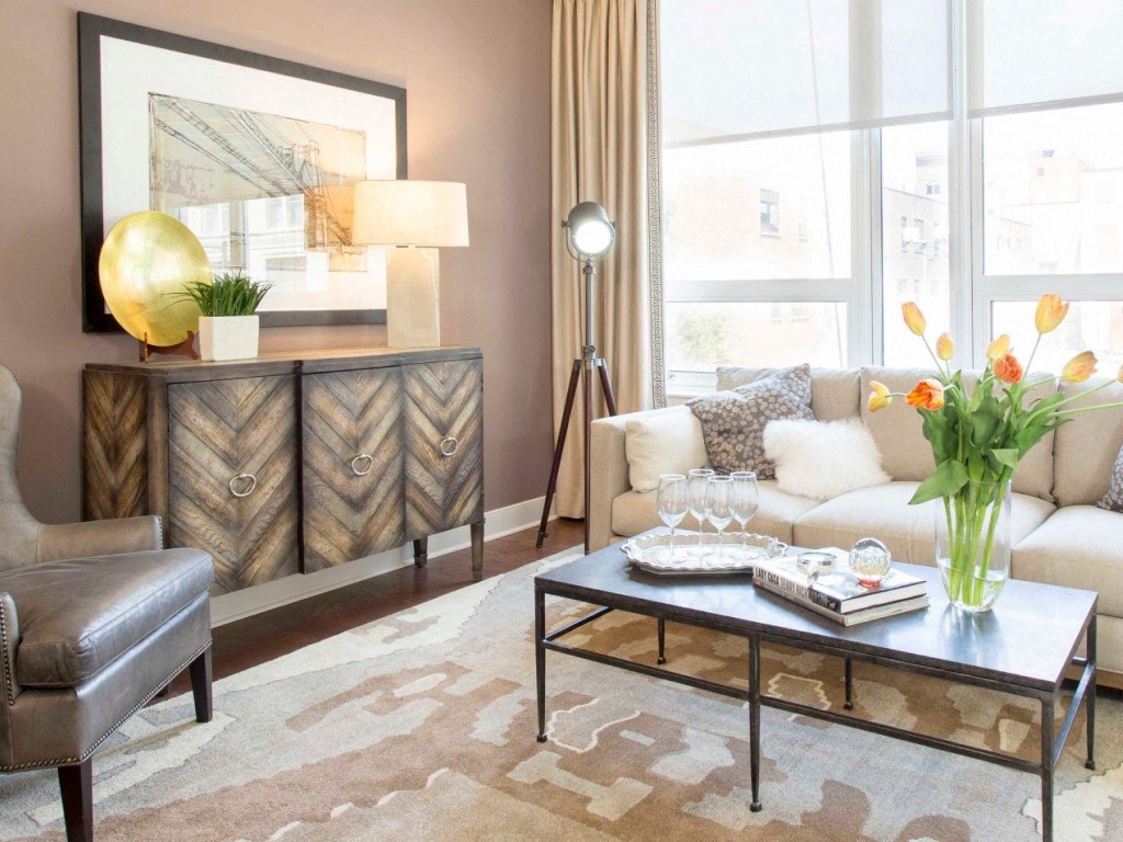 A fully furnished living room in a 1900 Arch sample unit