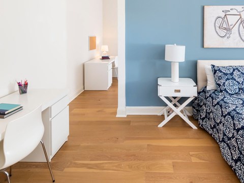 A Kardon Atlantic bedroom features hardwood flooring