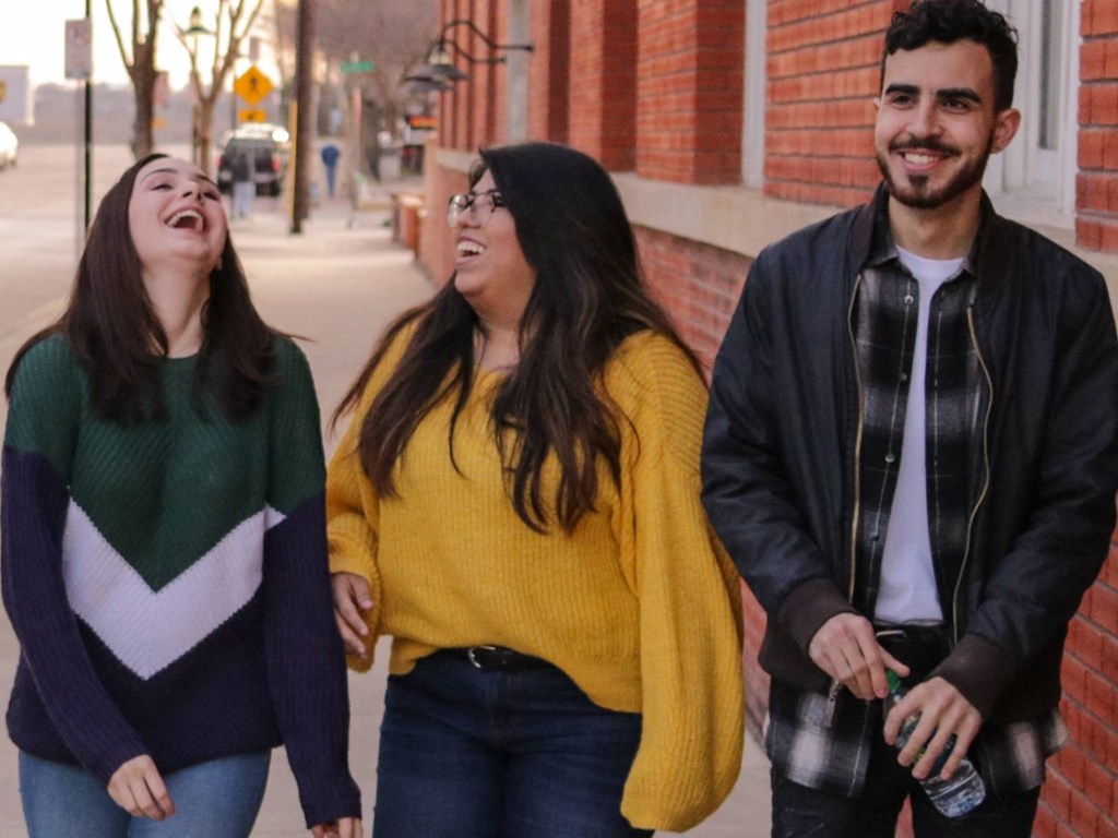 Three Kardon Atlantic residents walking and laughing together.