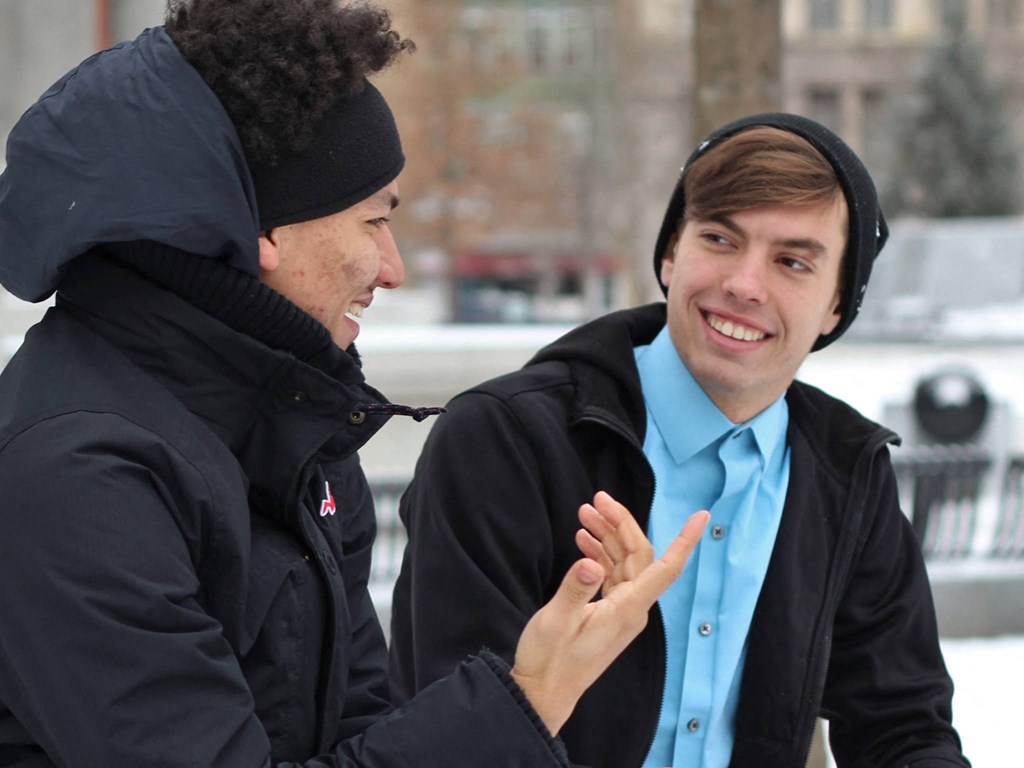 Students wait for their train at the nearby Temple station