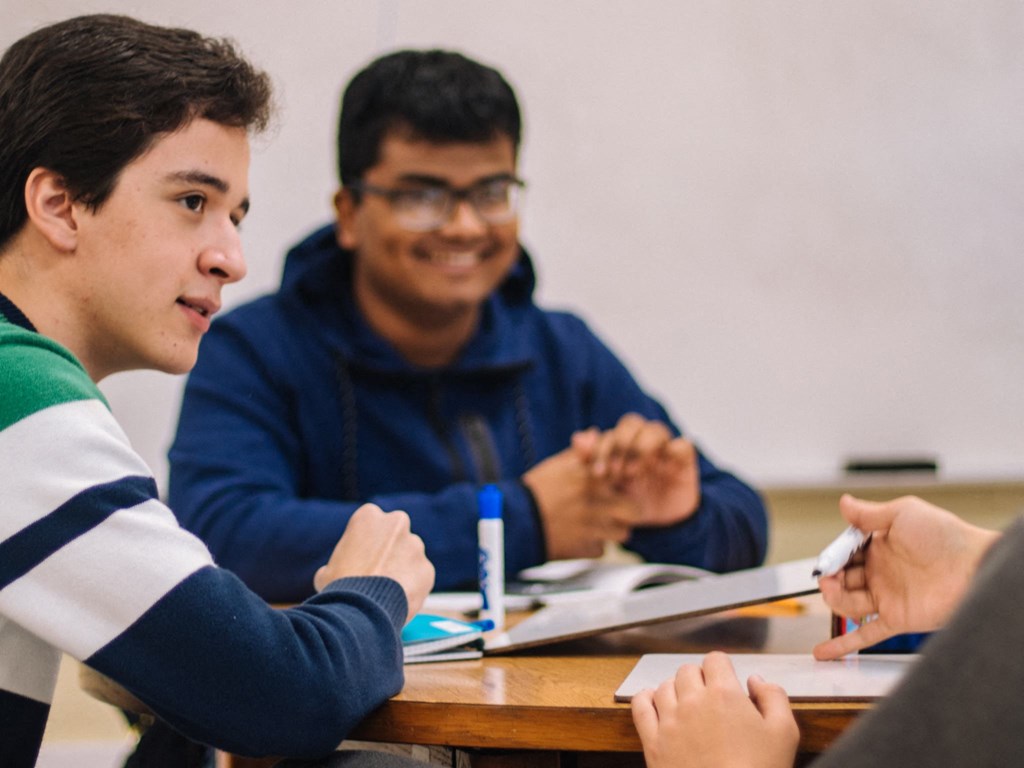 Three Kardon Atlantic residents do school work together