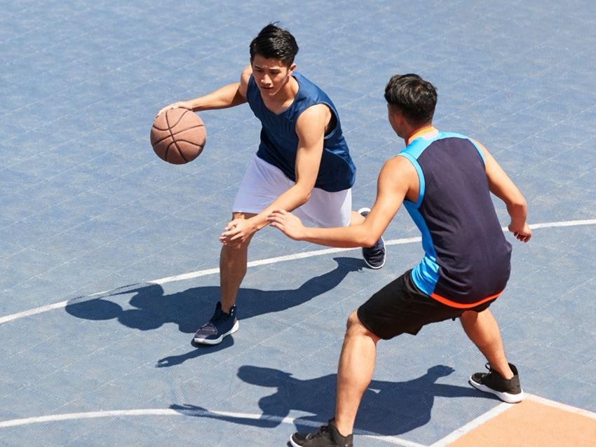 People playing basketball on a court - Photo Gallery 1