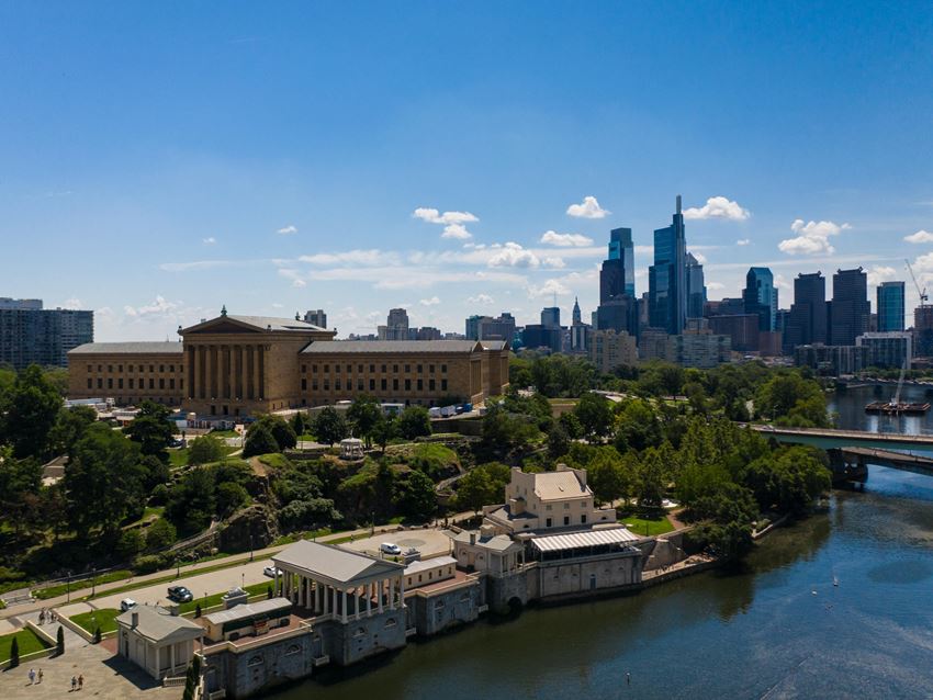 the Philadelphia Water Works and Philadelphia Museum of Art next to the river with the skyline behind it - Photo Gallery