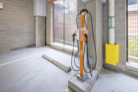 A charging station for electric vehicles is installed in a parking area.