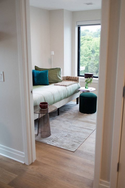 a living room with a couch and a window