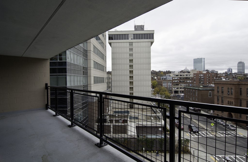 a balcony with a view of the city