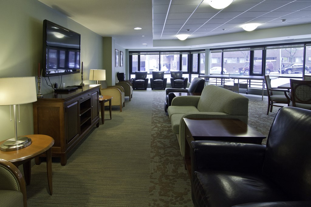 a living room filled with furniture and a television