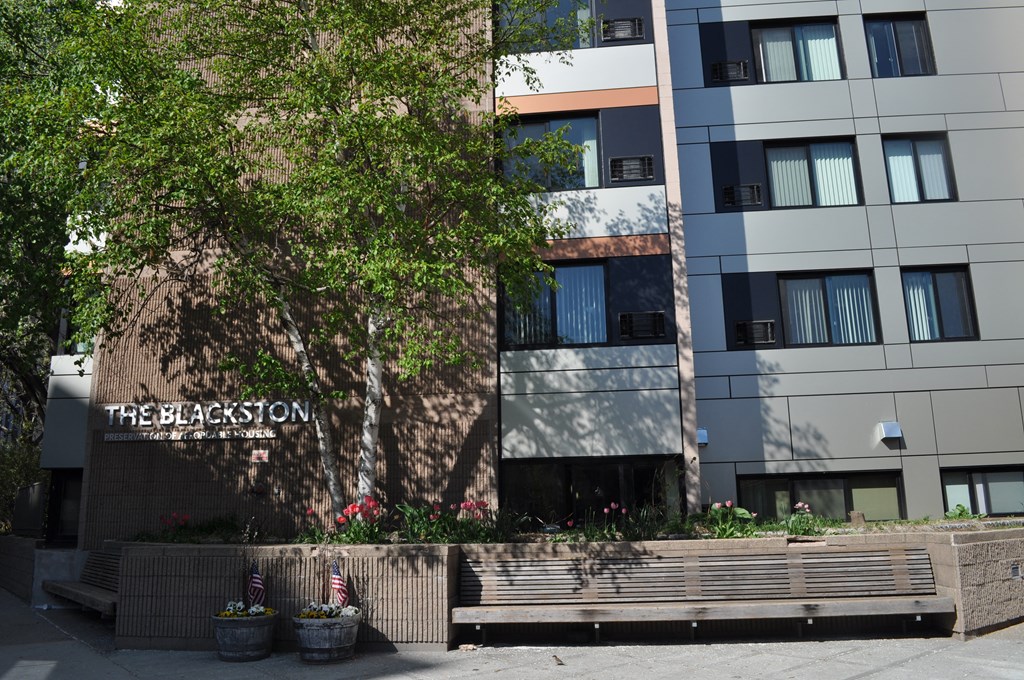 a building with a sign that reads the blossom on it