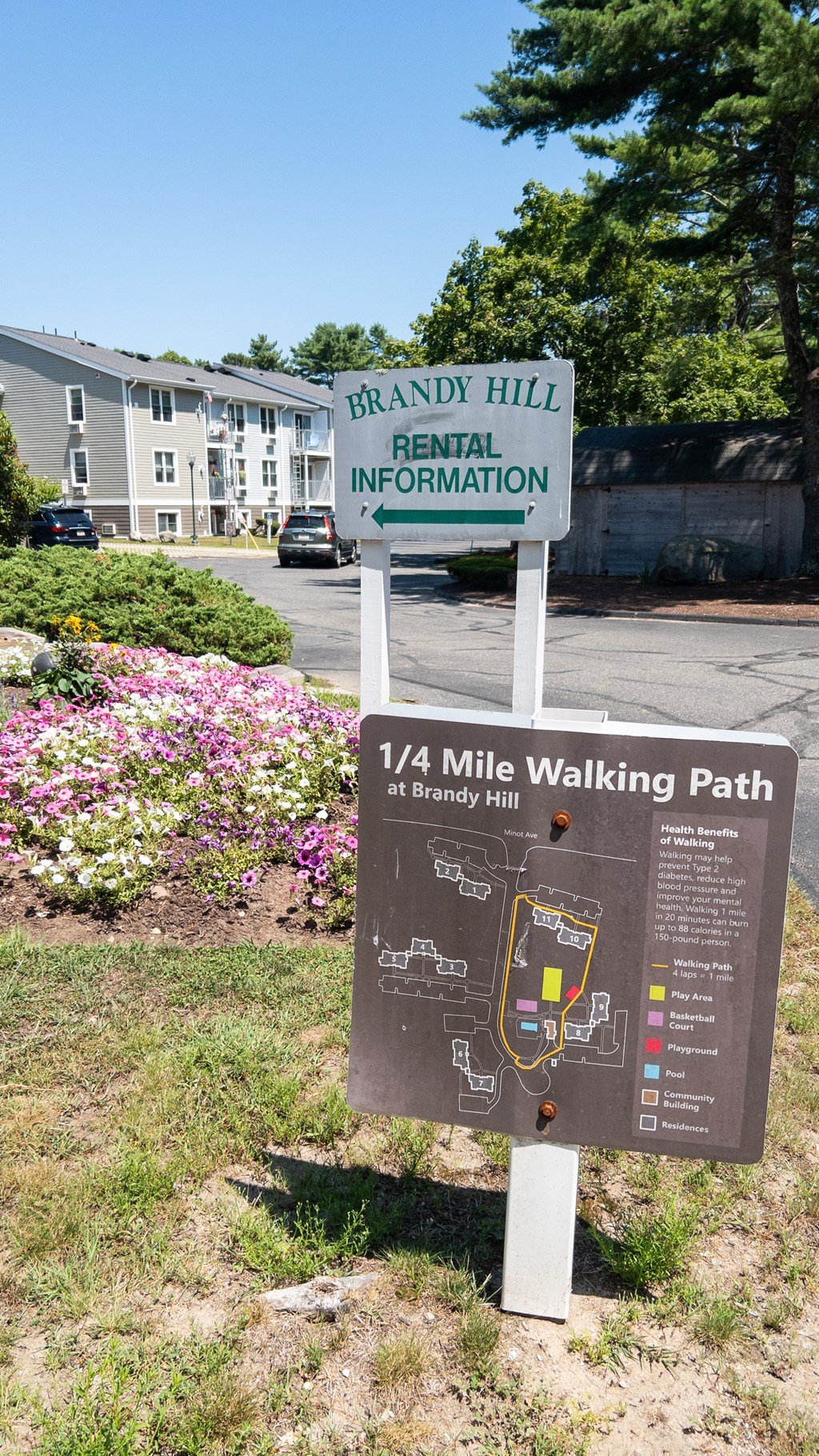 A sign for Brandy Hill Rental Information and a 1/4 mile walking path.