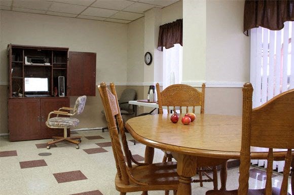 a dining room with a table and chairs