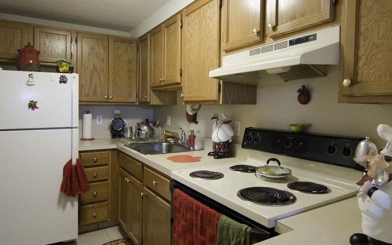 a kitchen with a stove and a refrigerator