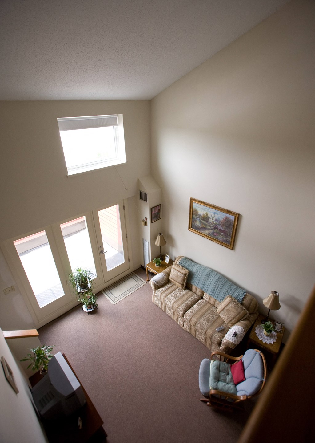 an overhead view of a living room with a couch