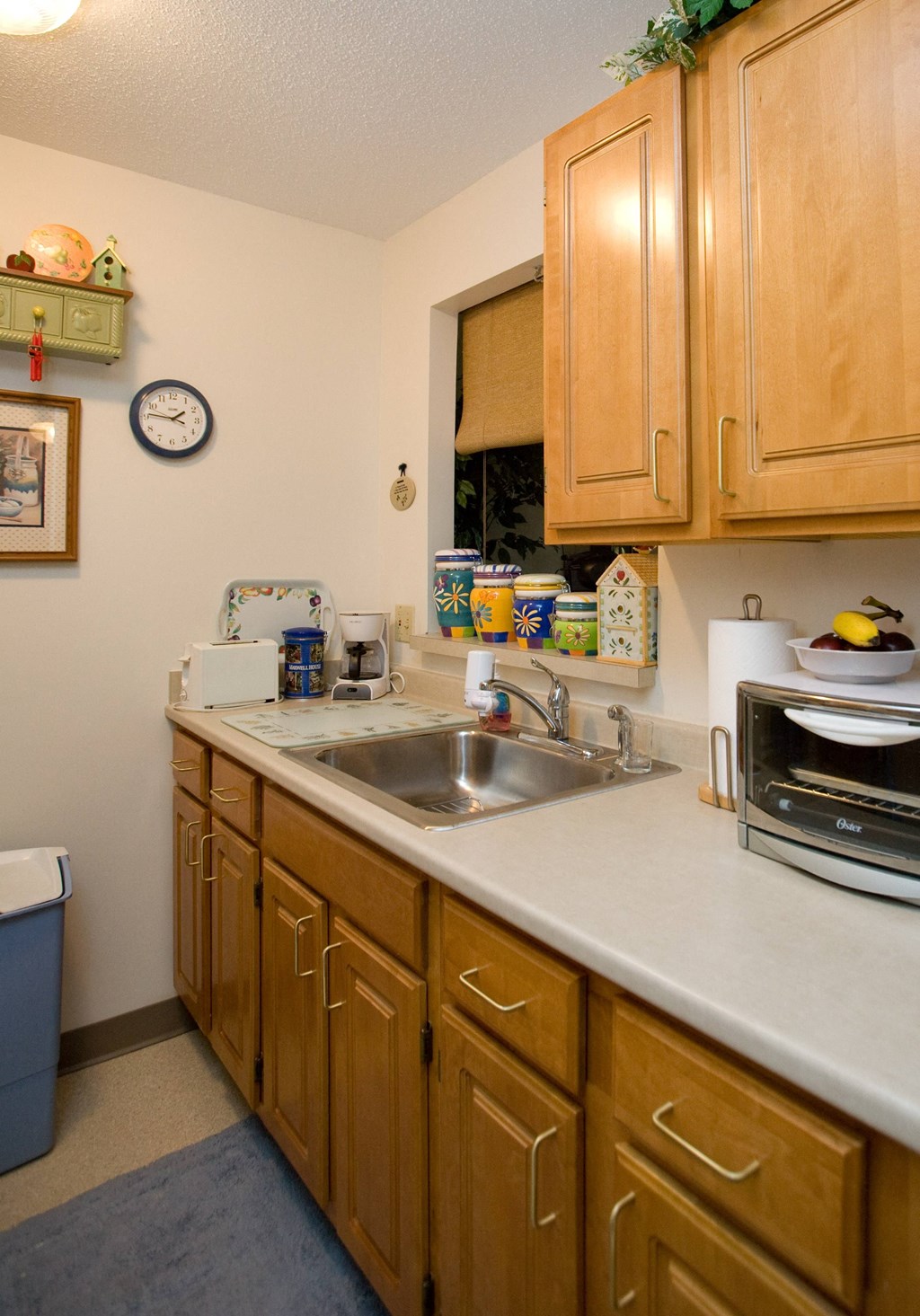 a kitchen with wooden cabinets and a sink