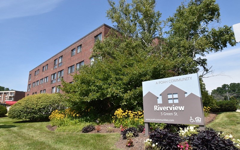 A building with a sign that says Riverview in front of it.