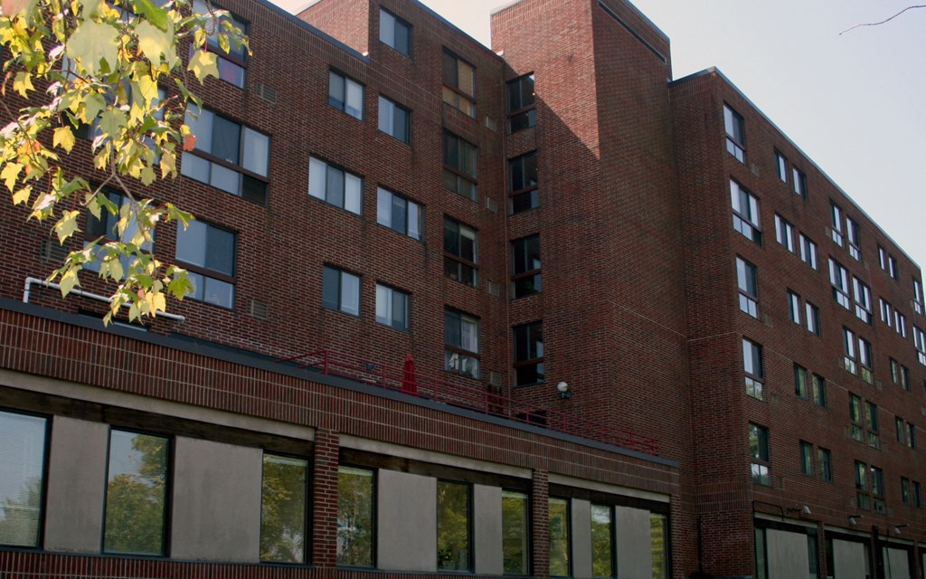 A red brick building with many windows.