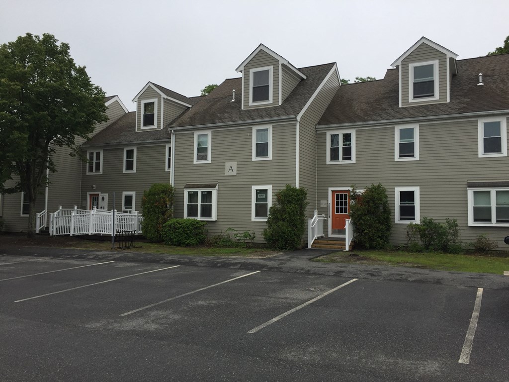 a row of houses in a parking lot