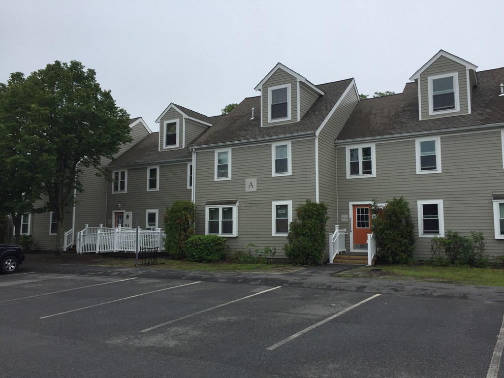 a row of houses in a parking lot