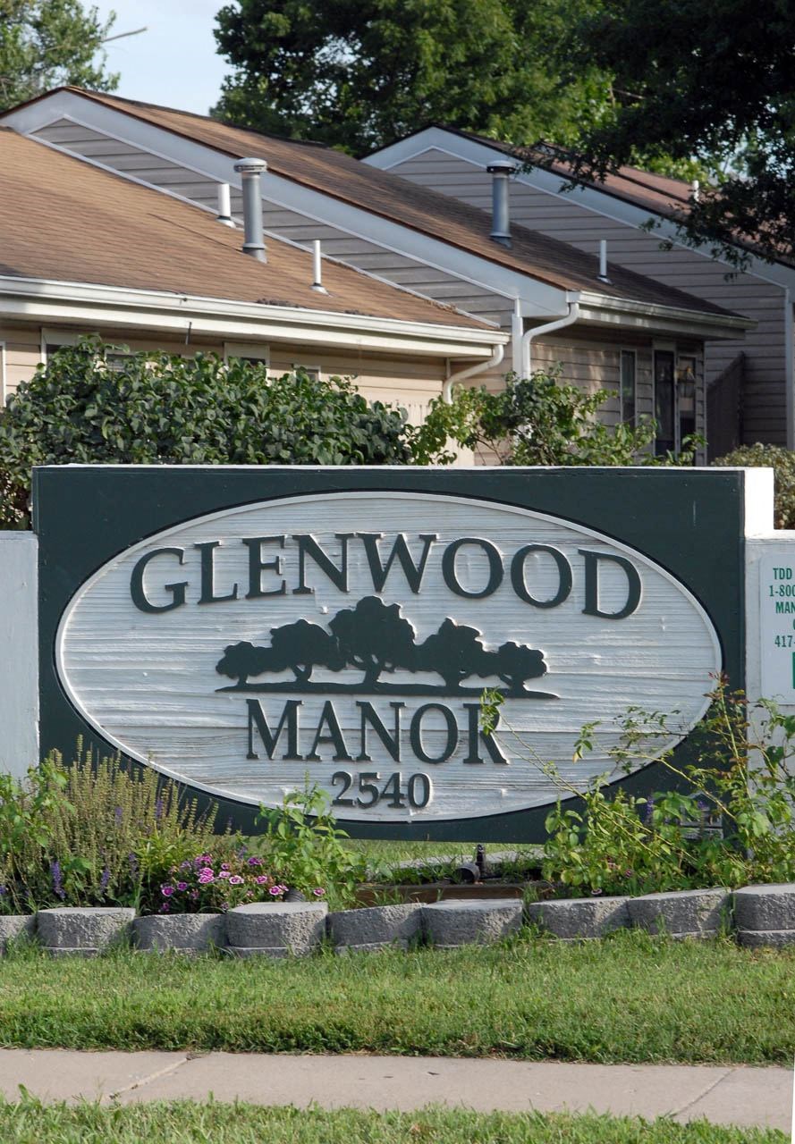 a sign in front of a house
