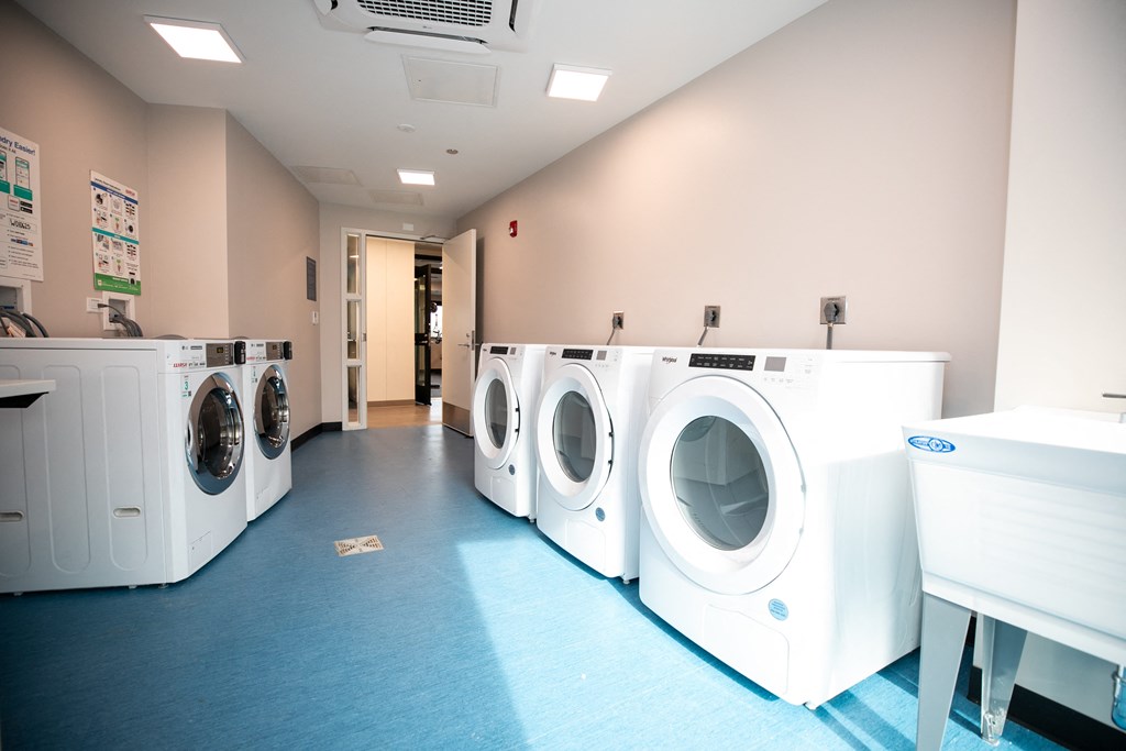 A row of washing machines in a laundromat.