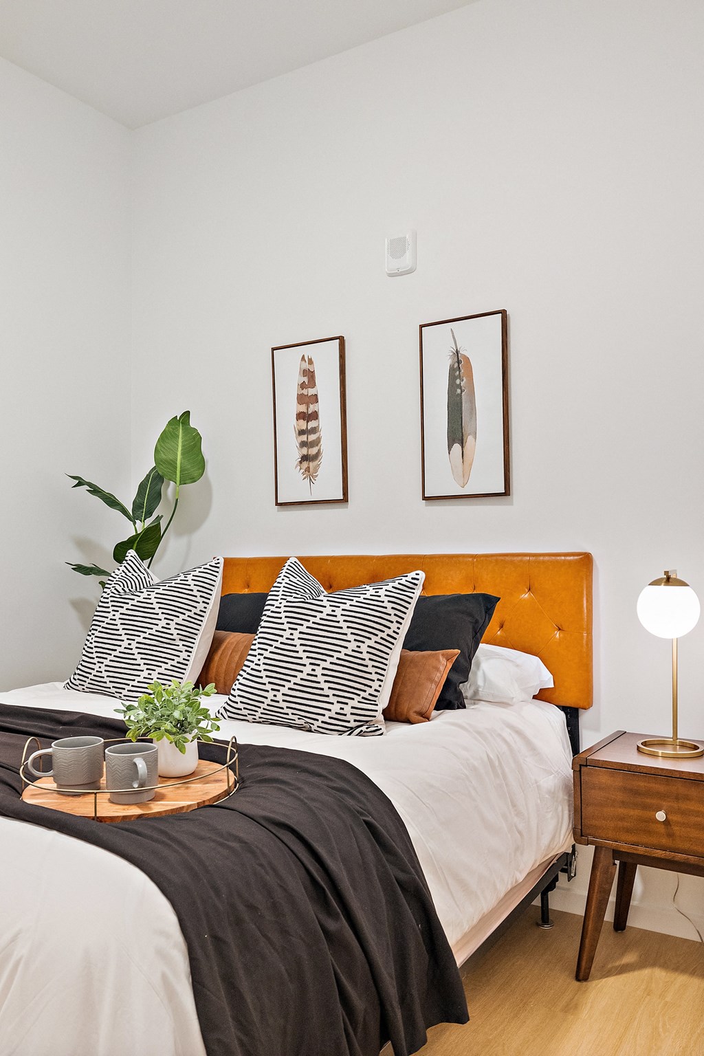 Bedroom with bed and lamps at The Freelon at Sugar Hill, Detroit, MI 48201