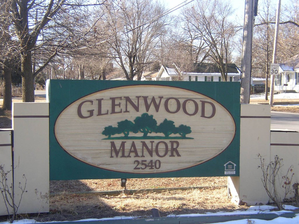 a sign in front of a house