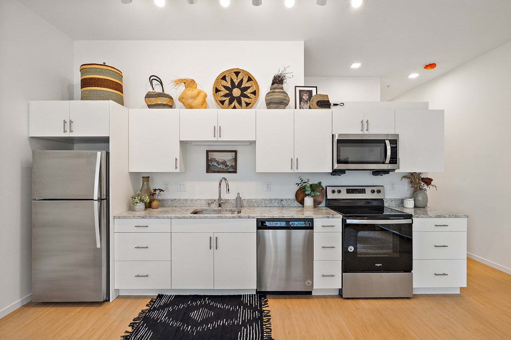 Kitchen with appliances and cabinets at The Freelon at Sugar Hill, Detroit, MI 48201