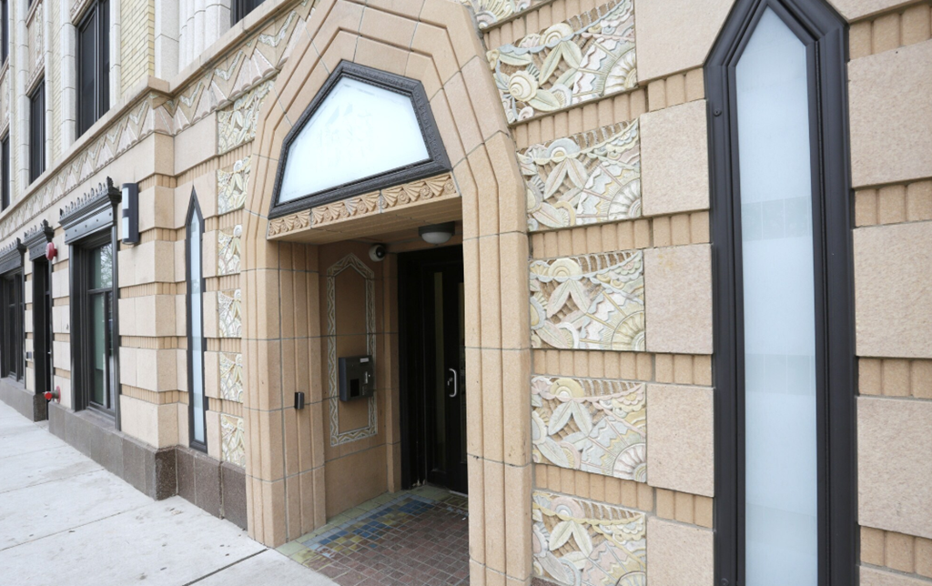 the entrance to a building with a door and a window